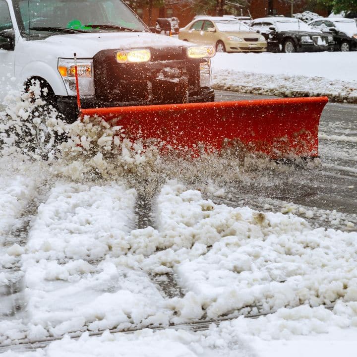 Snow plow clearing snow